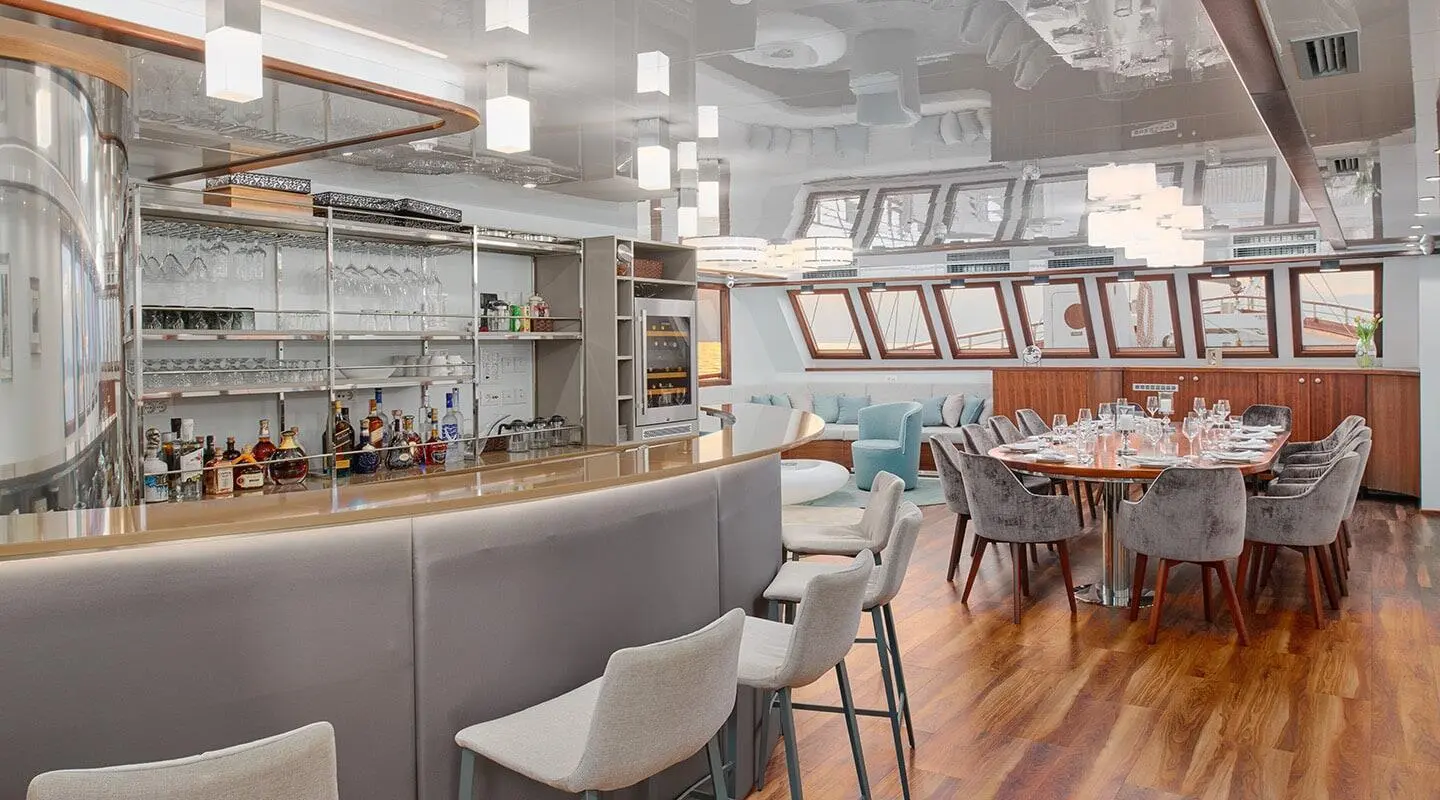 Interior of Corsario luxury gulet yacht, dining and seating area at sunset
