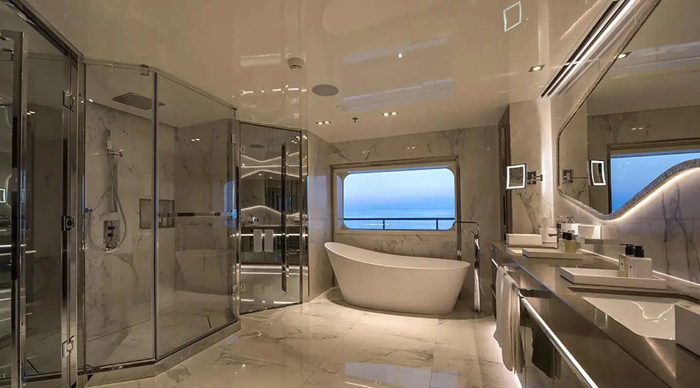 Luxurious yacht bathroom with a window view and polished surfaces aboard Marquise
