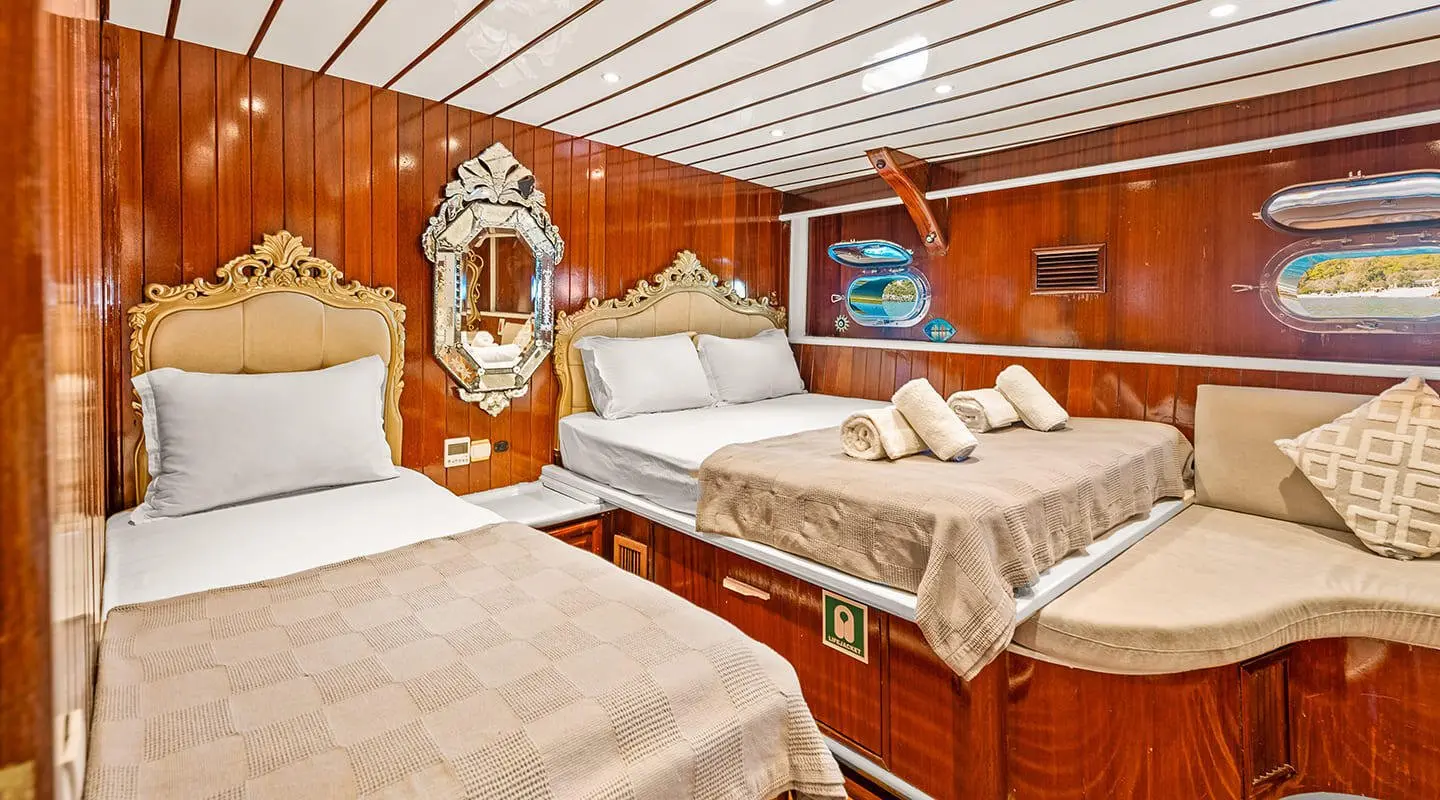 Interior of Esma Sultan luxury gulet with wooden furnishings and cushions