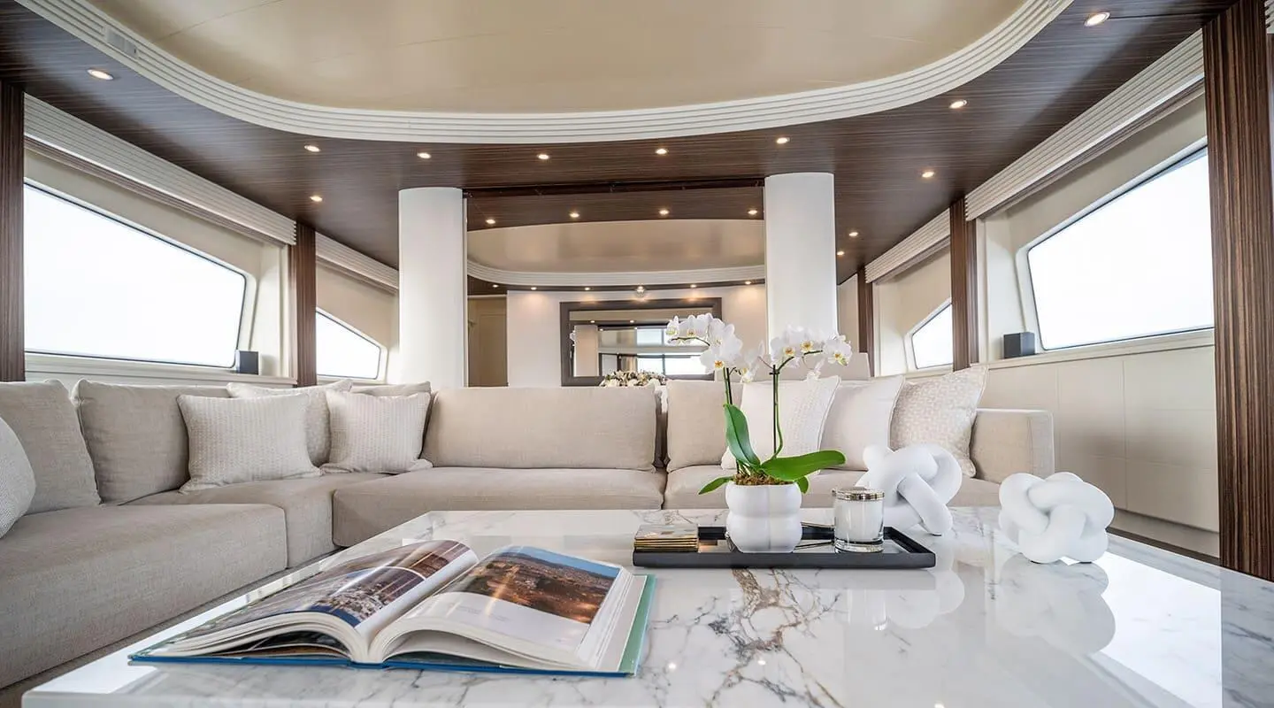Luxurious yacht Pareaki II salon with plush seating and coffee table