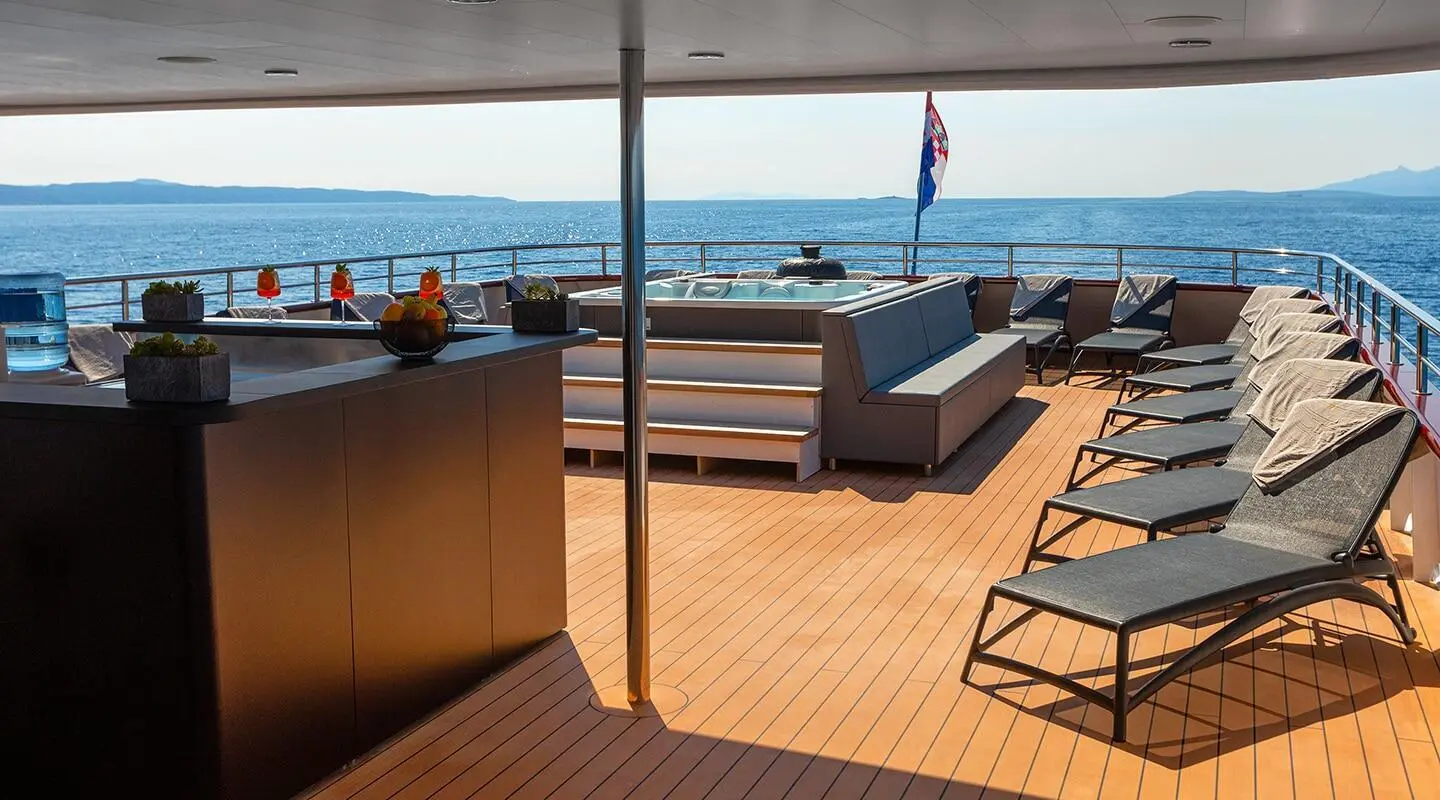 View from the yacht Sun Deck Yolo toward the sea with lounge chairs