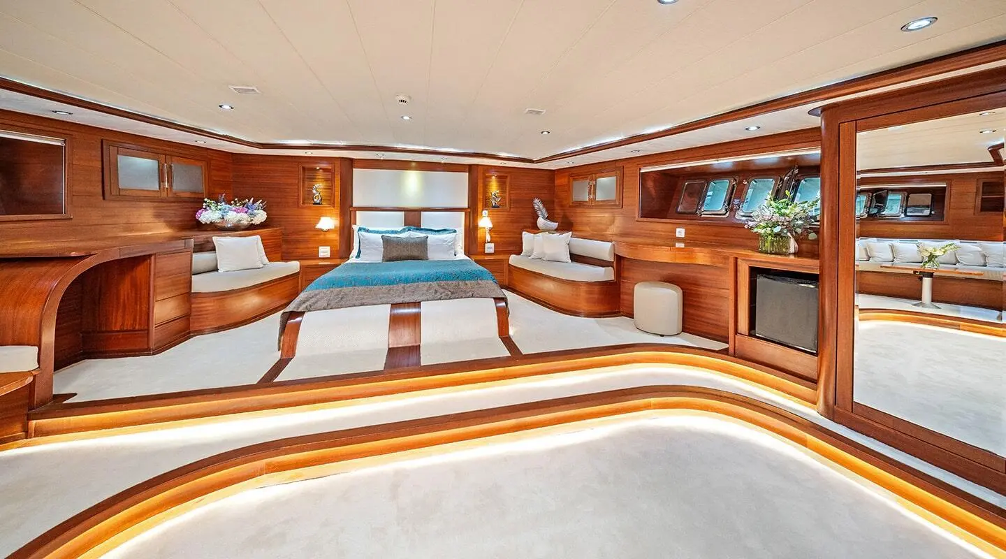 Interior of gulet Alessandro I yacht with polished wood accents and seating area