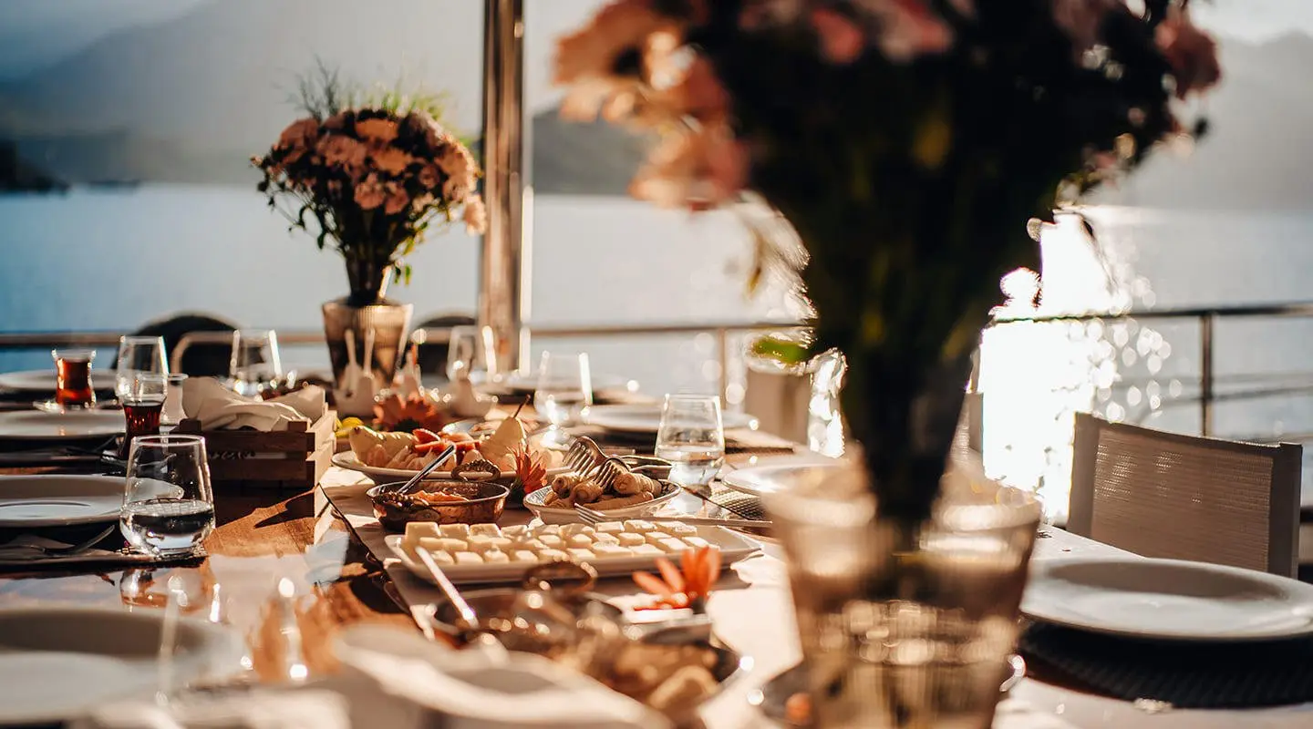 Gulet Queen Of Makri yacht with table set for meal on deck