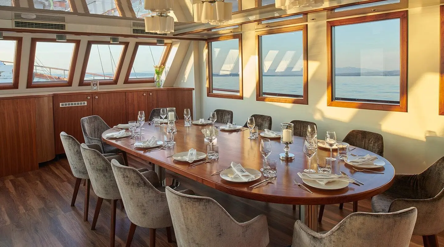 Corsario luxury gulet yacht dining area set for sunset meal aboard