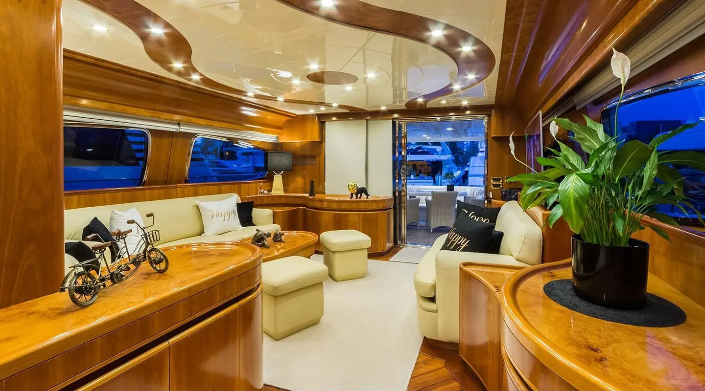 Interior of Amoraki motor yacht saloon with beige seating and wood trim