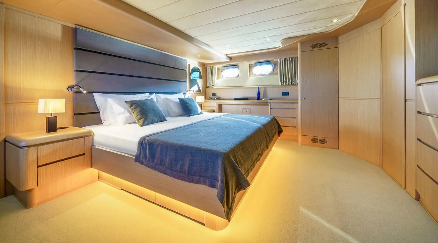 Sleek Phantom yacht interior with two beds and warm lighting