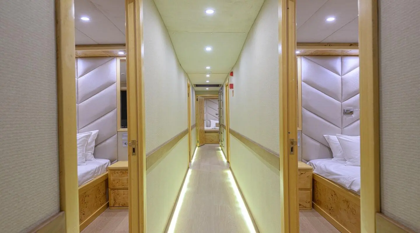 Belgin Sultan luxury gulet at sunset, sailboat deck with warm lighting