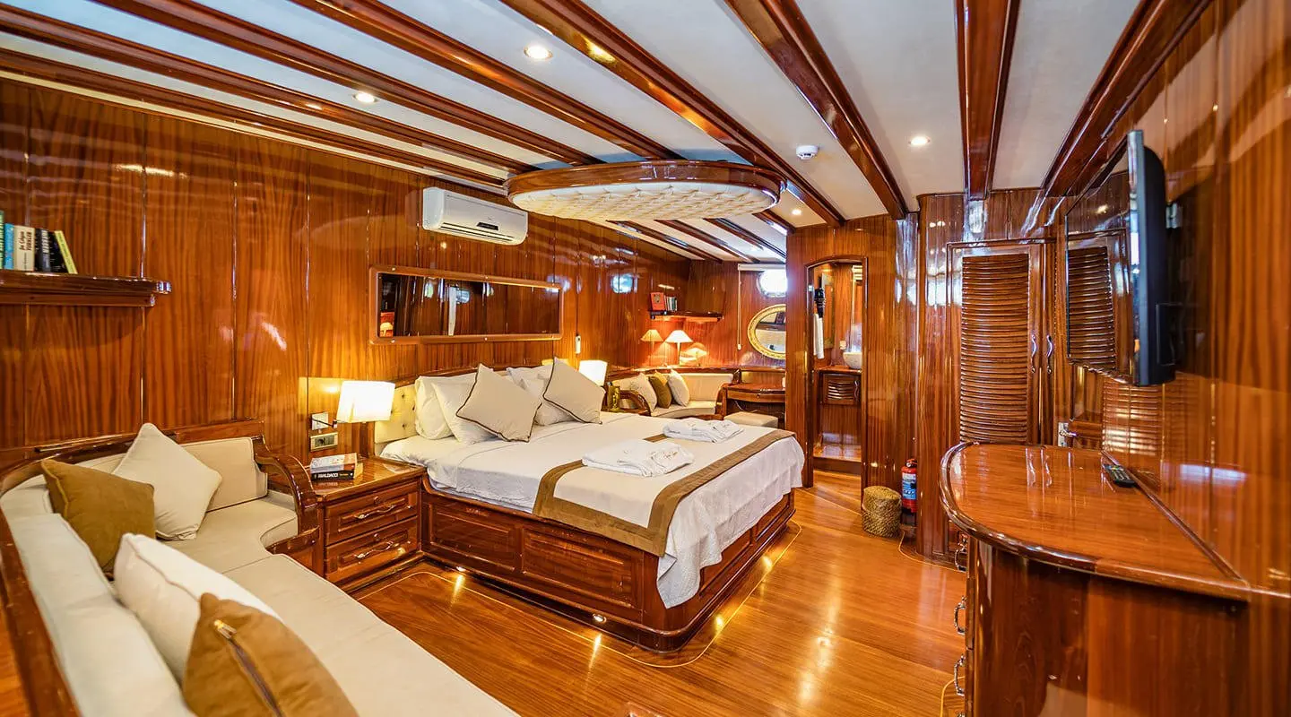 Lycian Queen luxury gulet interior with wooden beams and double beds