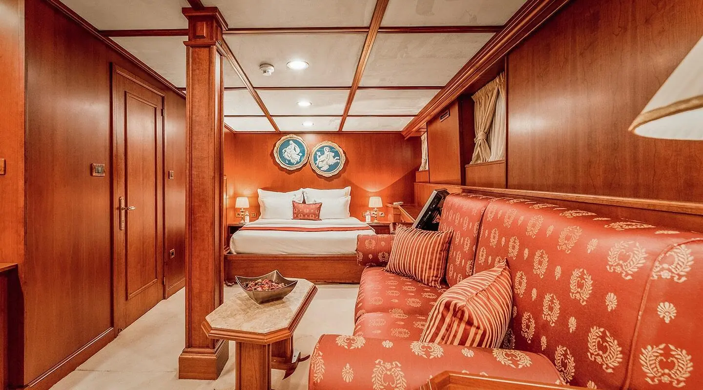 Interior of Seagull II yacht living area with cushions and wooden panels