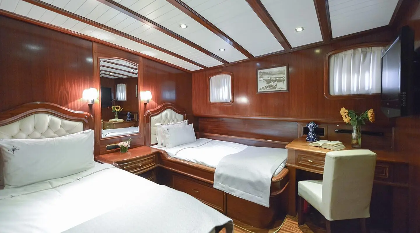 Interior of Lady Christa gulet with twin cabins and wooden decor