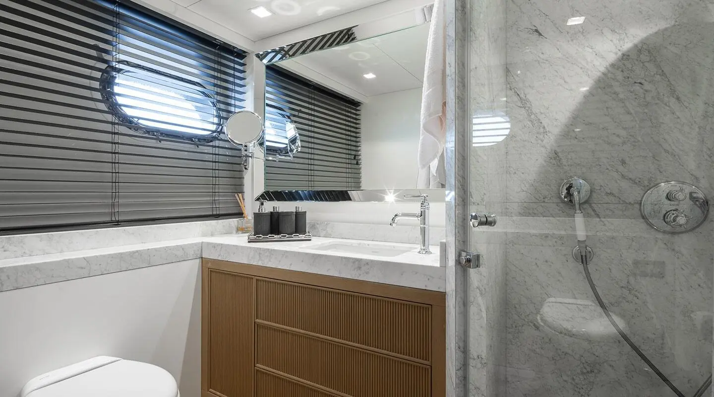 Illusion II yacht deck aboard, wooden cabin, windows, and seating visible