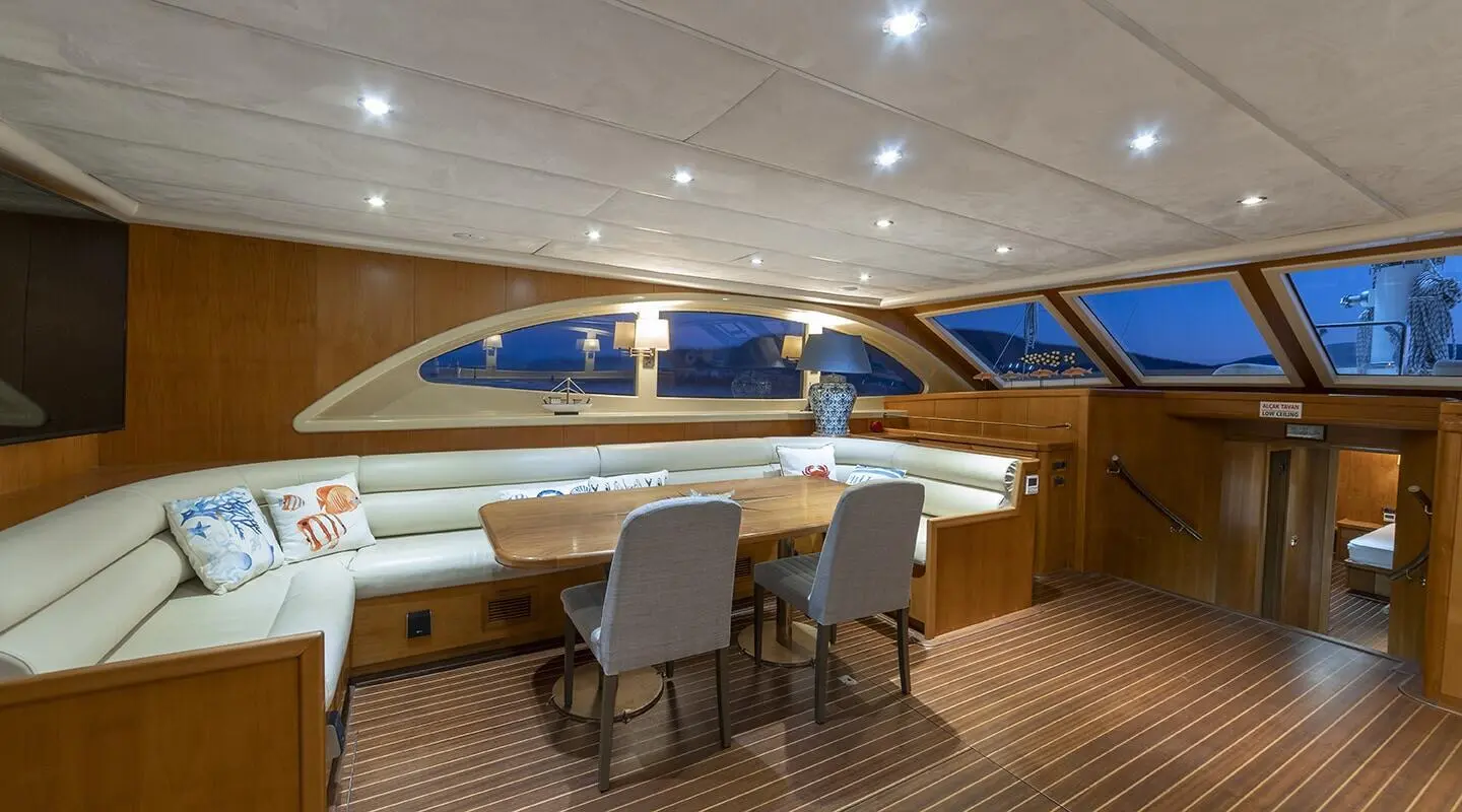 Queen Of Sea yacht charter: sunset sail on deck with seating and windows