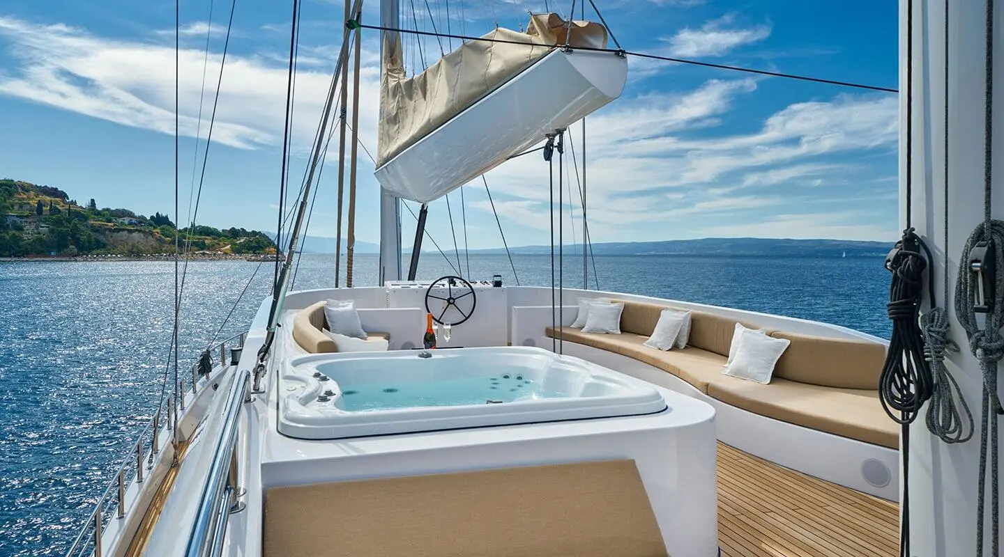Acapella yacht cockpit with hedge and sun pads, blue ocean beyond