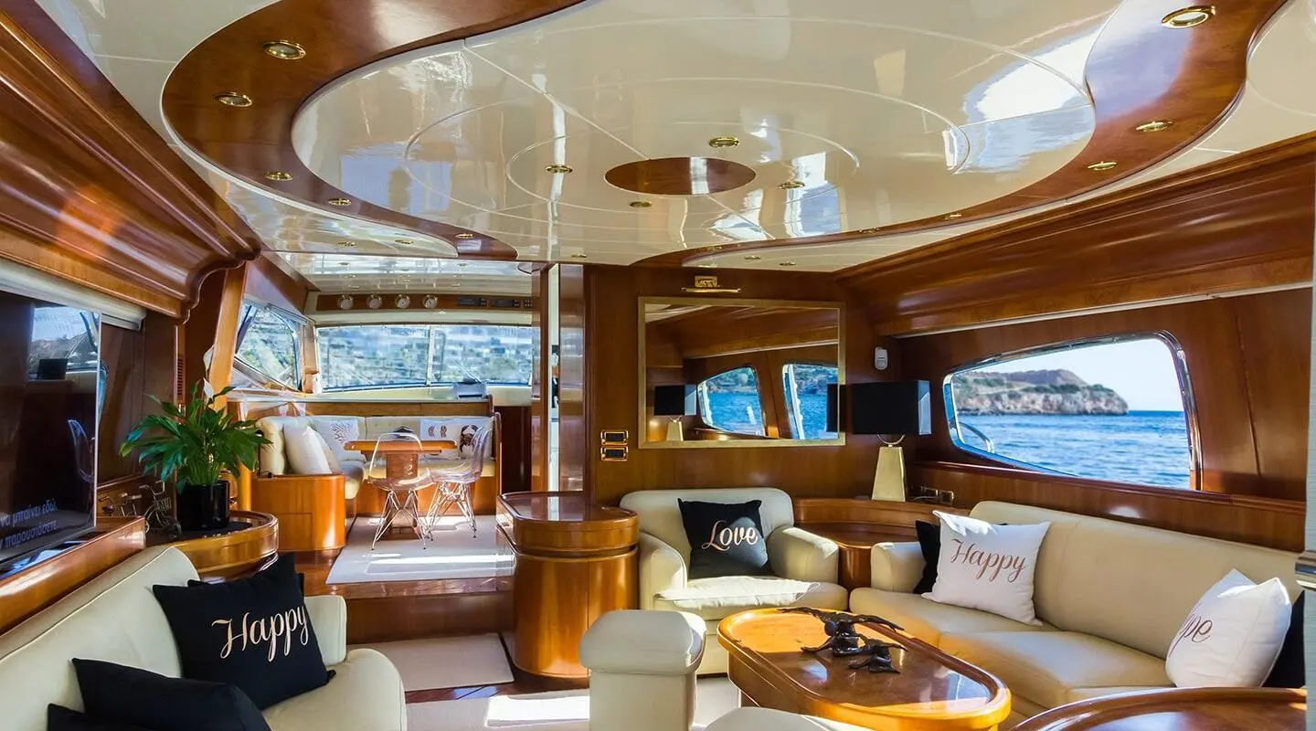 Luxurious yacht Amoraki interior salon with cream seating and wood panels
