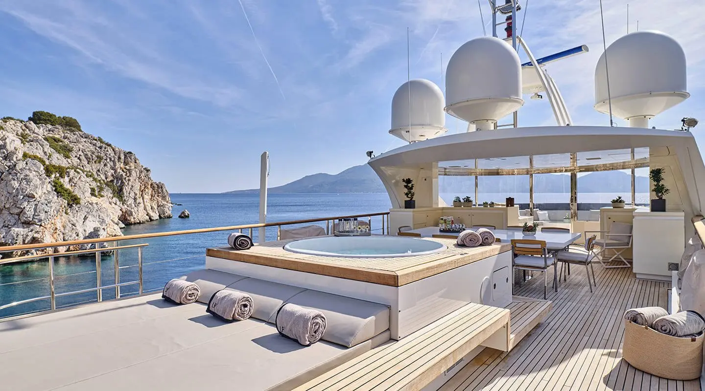 La Pellegrina 1 yacht deck at sunset with sun loungers and rigging