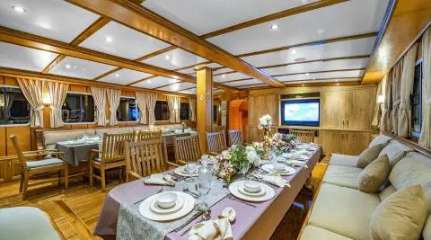 Tersane 8 yacht dining area aboard a luxury gulet at sunset with table setting