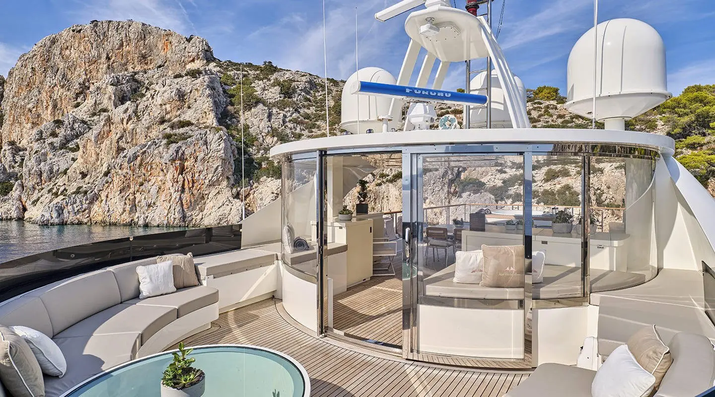 La Pellegrina 1 yacht sun deck with seating and view, bright day