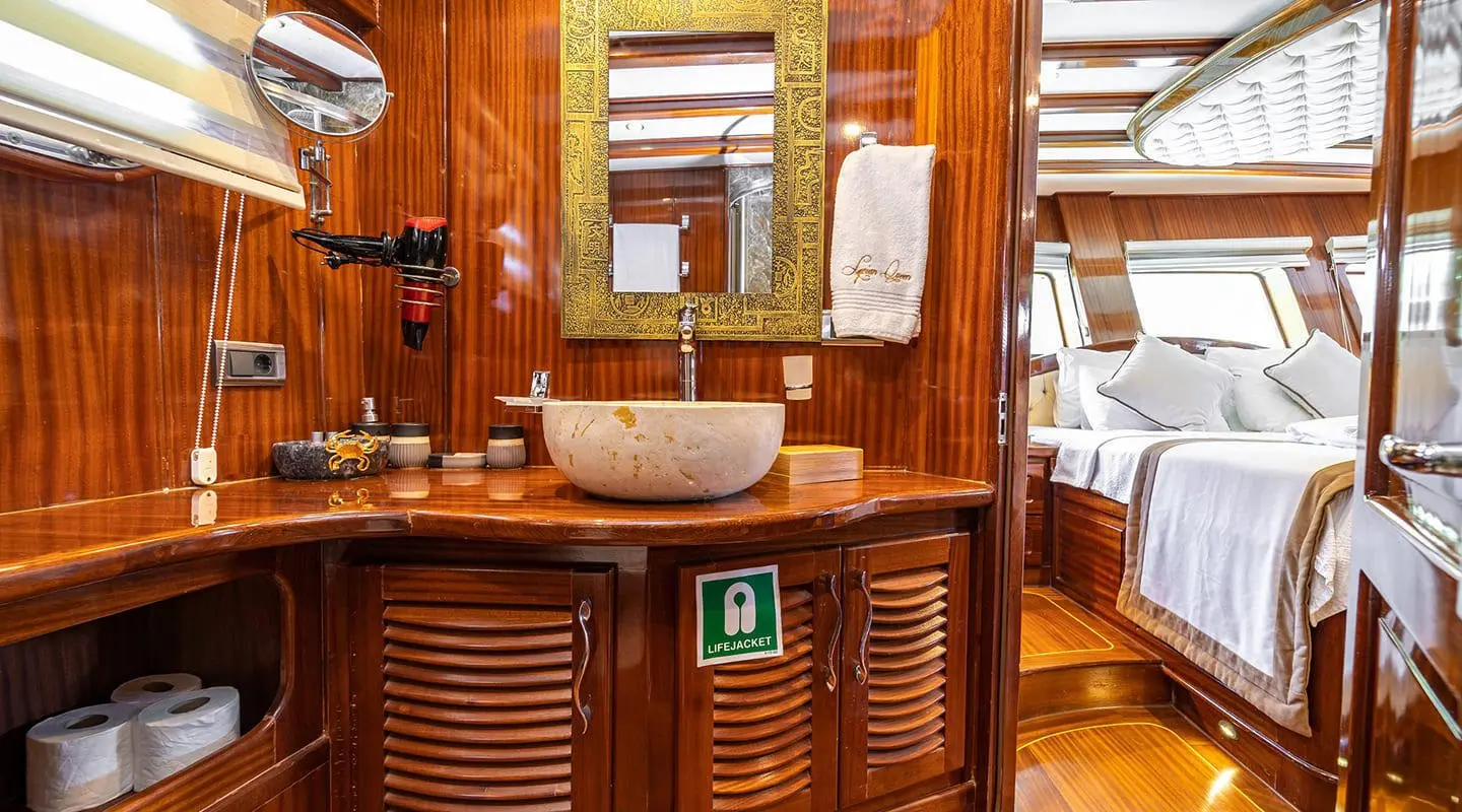 Yacht Lycian Queen interior bar area with wood paneling and seating