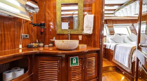 Yacht Lycian Queen interior bar area with wood paneling and seating