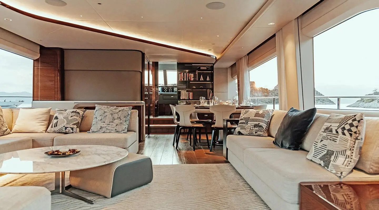 Vista luxury motor yacht interior with seating, table, and large windows