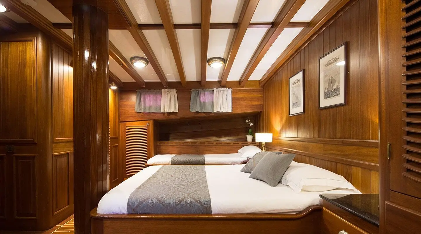 Carpe Diem 7 yacht cabin with wooden beams and double bed