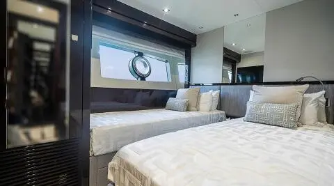 Luxurious yacht Quantum bedroom with large bed and panoramic window