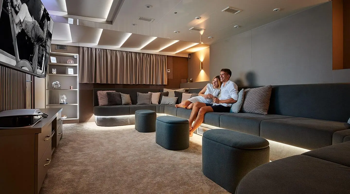 Lupus Mare luxury yacht interior with seating area, lamps, and large windows