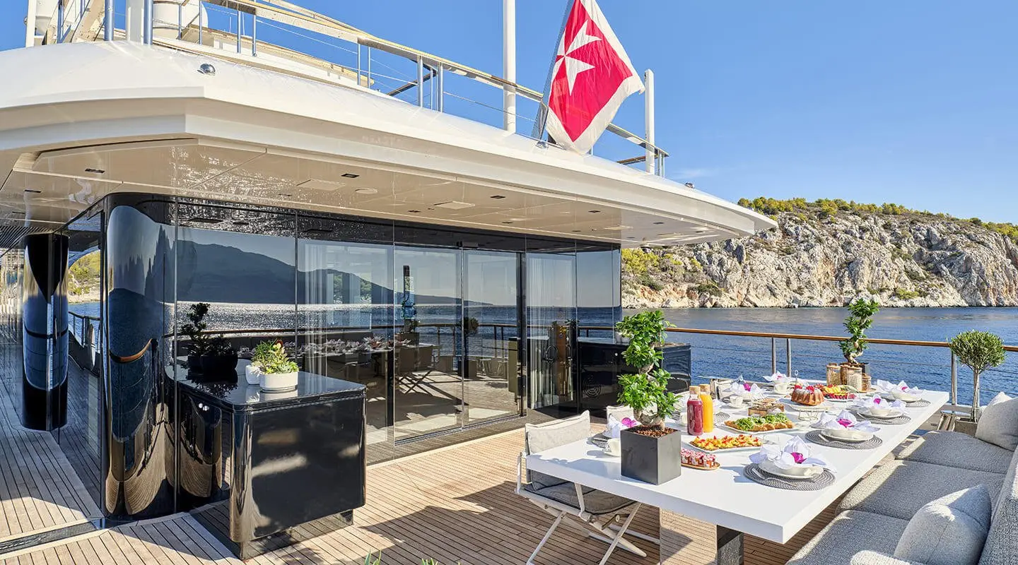 La Pellegrina 1 yacht outdoor dining area with table settings and seating
