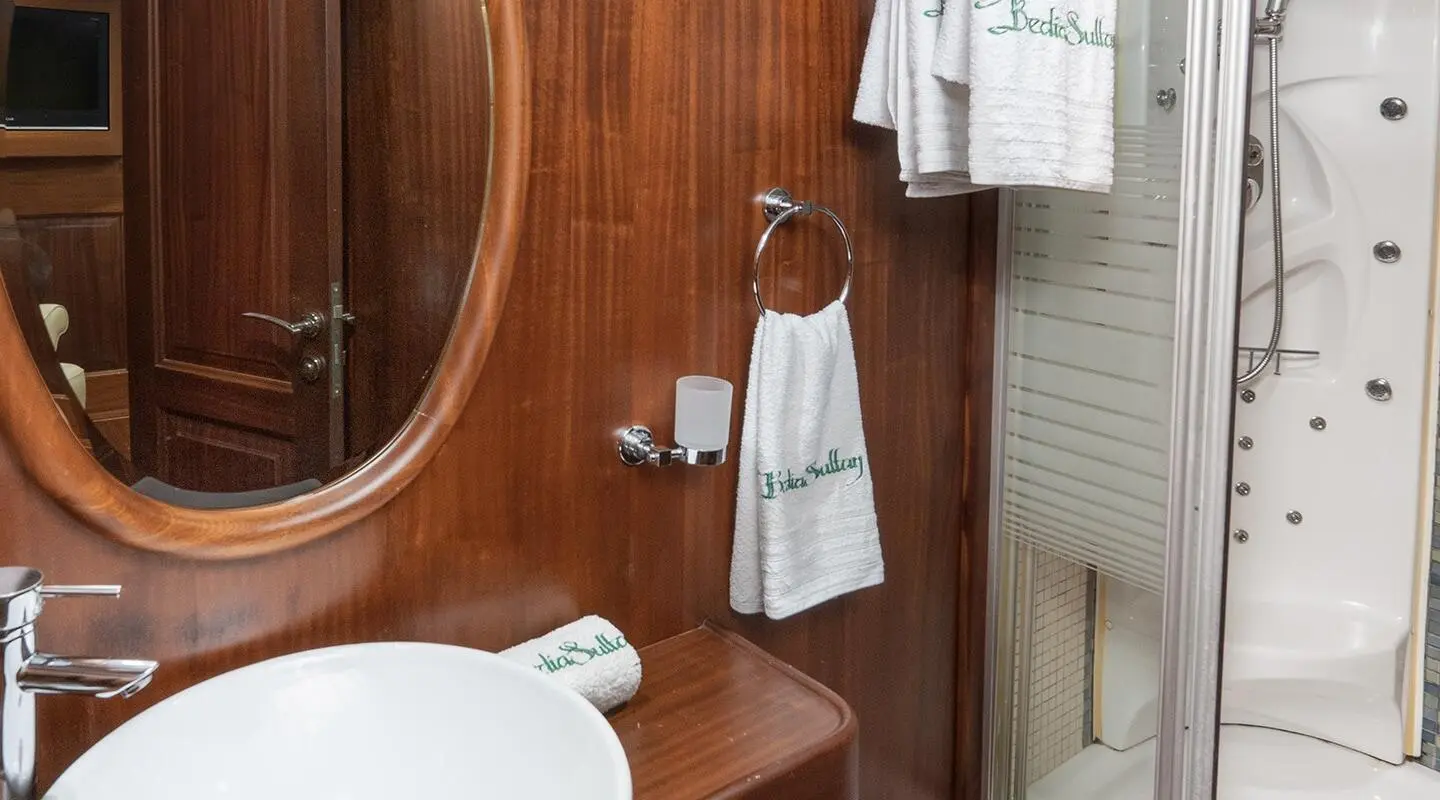 Bathroom on Bedia Sultan gulet showing towel rack and wooden fittings