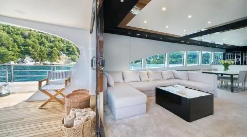 Acapella yacht salon entrance area with seating and open deck views