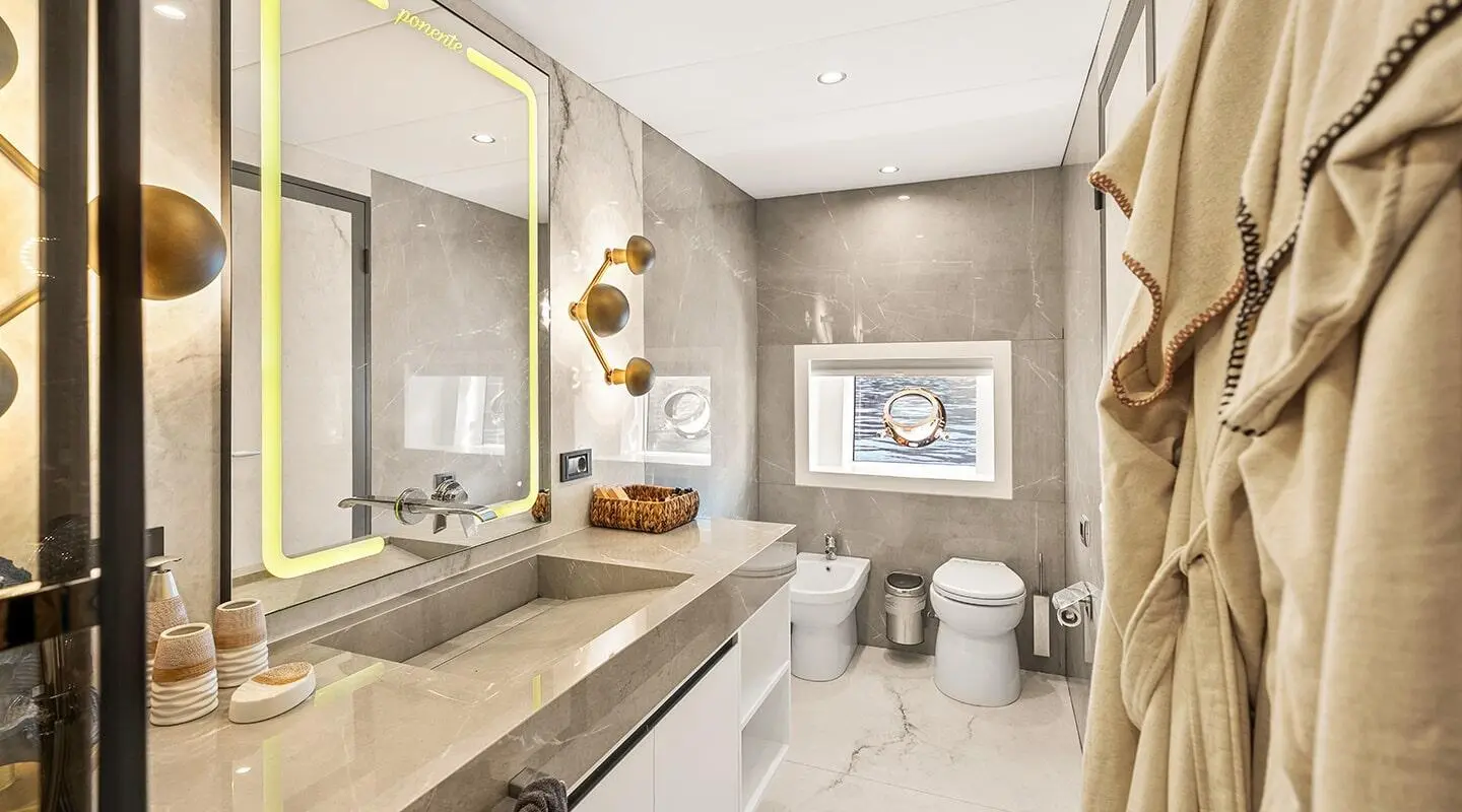Interior bathroom on North Wind yacht with sink, mirror, and vanity
