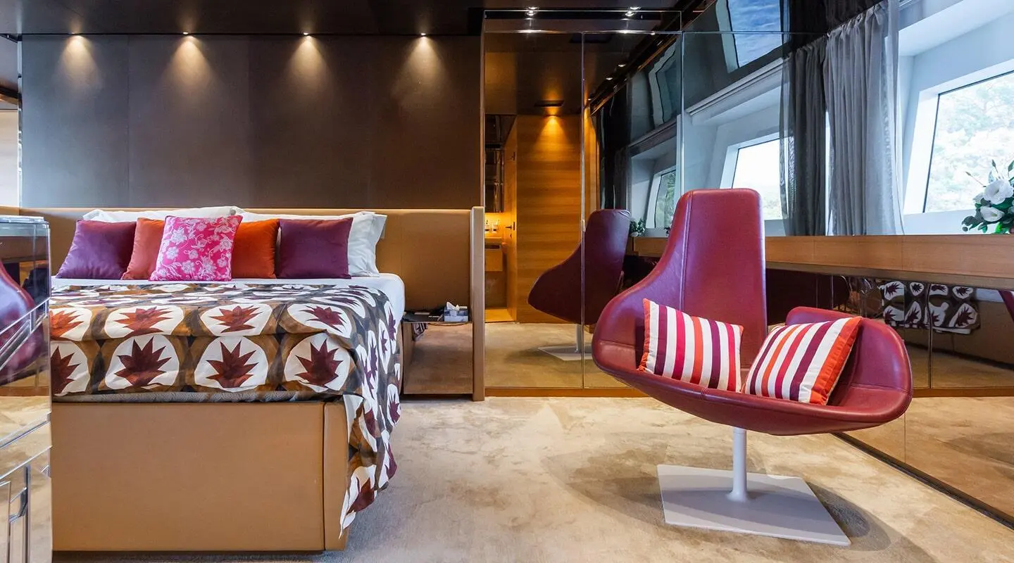 Takara One master cabin aboard yacht interior with bed and seating area