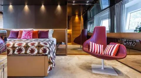 Takara One master cabin aboard yacht interior with bed and seating area