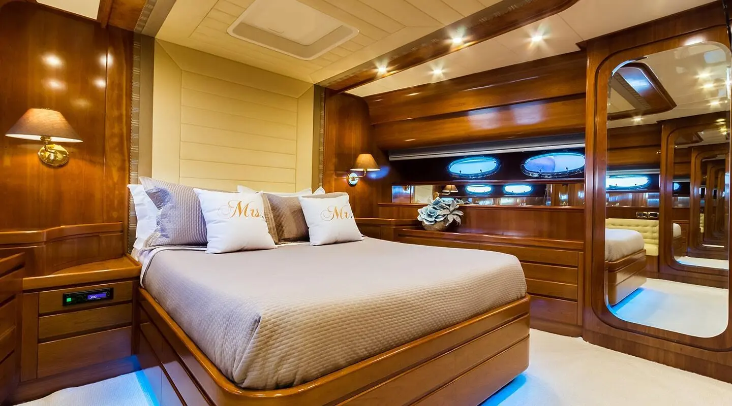 Amoraki motor yacht interior with double berth cabin and wood paneling