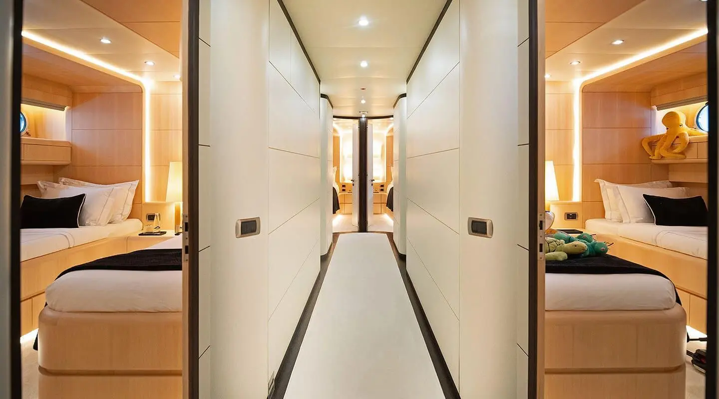 Pareaki II yacht interior hallway with warm lighting and polished floors