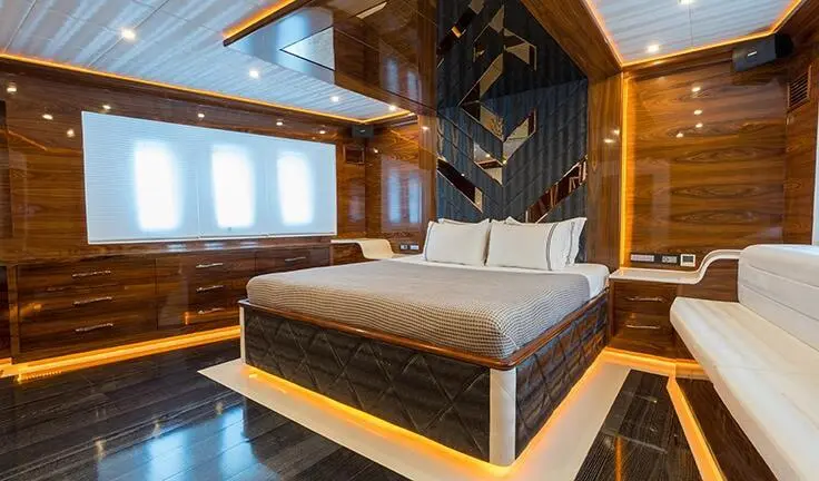 Master cabin with king bed, ensuite, wooden accents, large window view