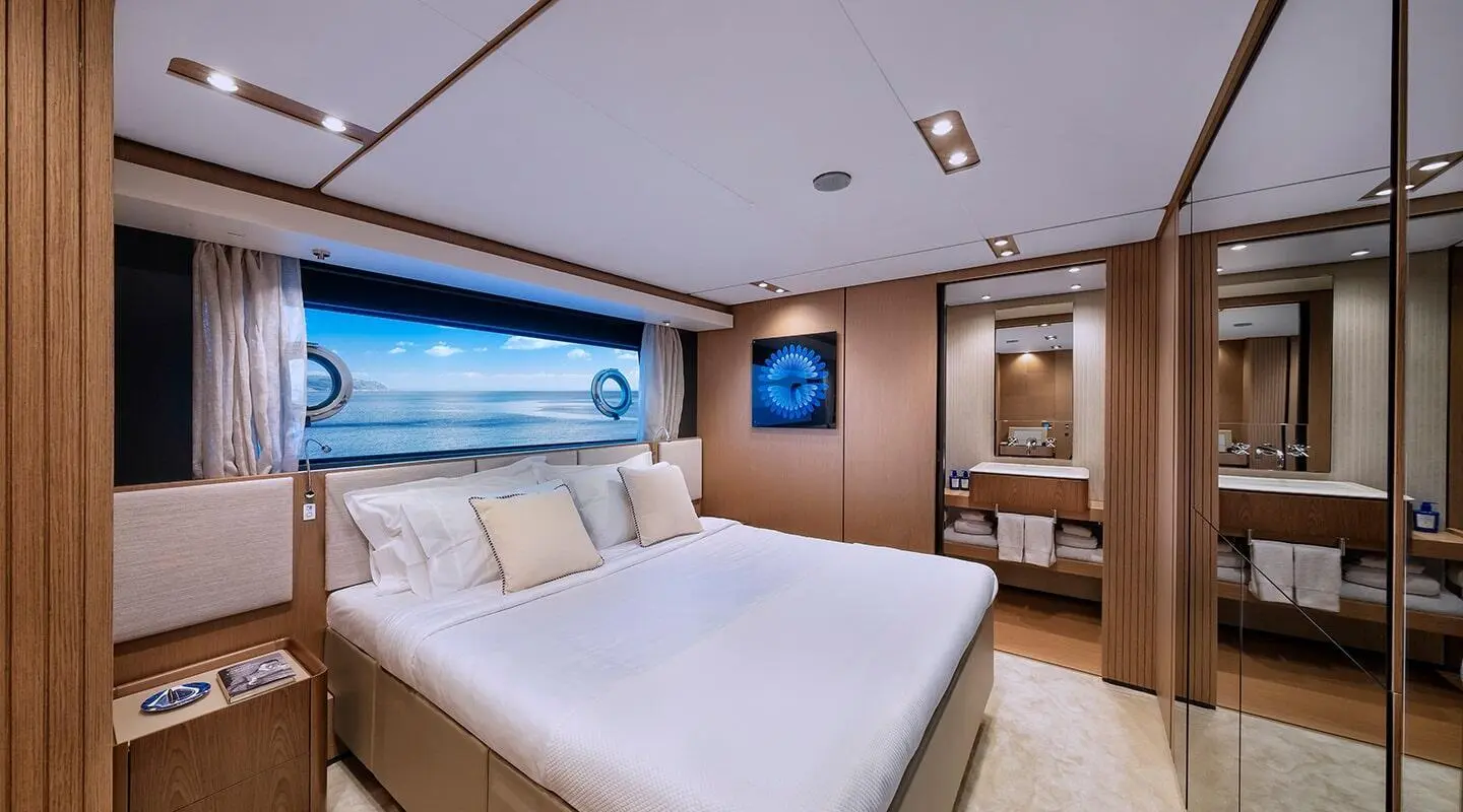 Spica yacht interior with a double cabin and neatly made bed