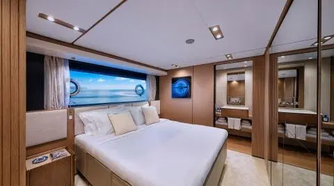 Spica yacht interior with a double cabin and neatly made bed