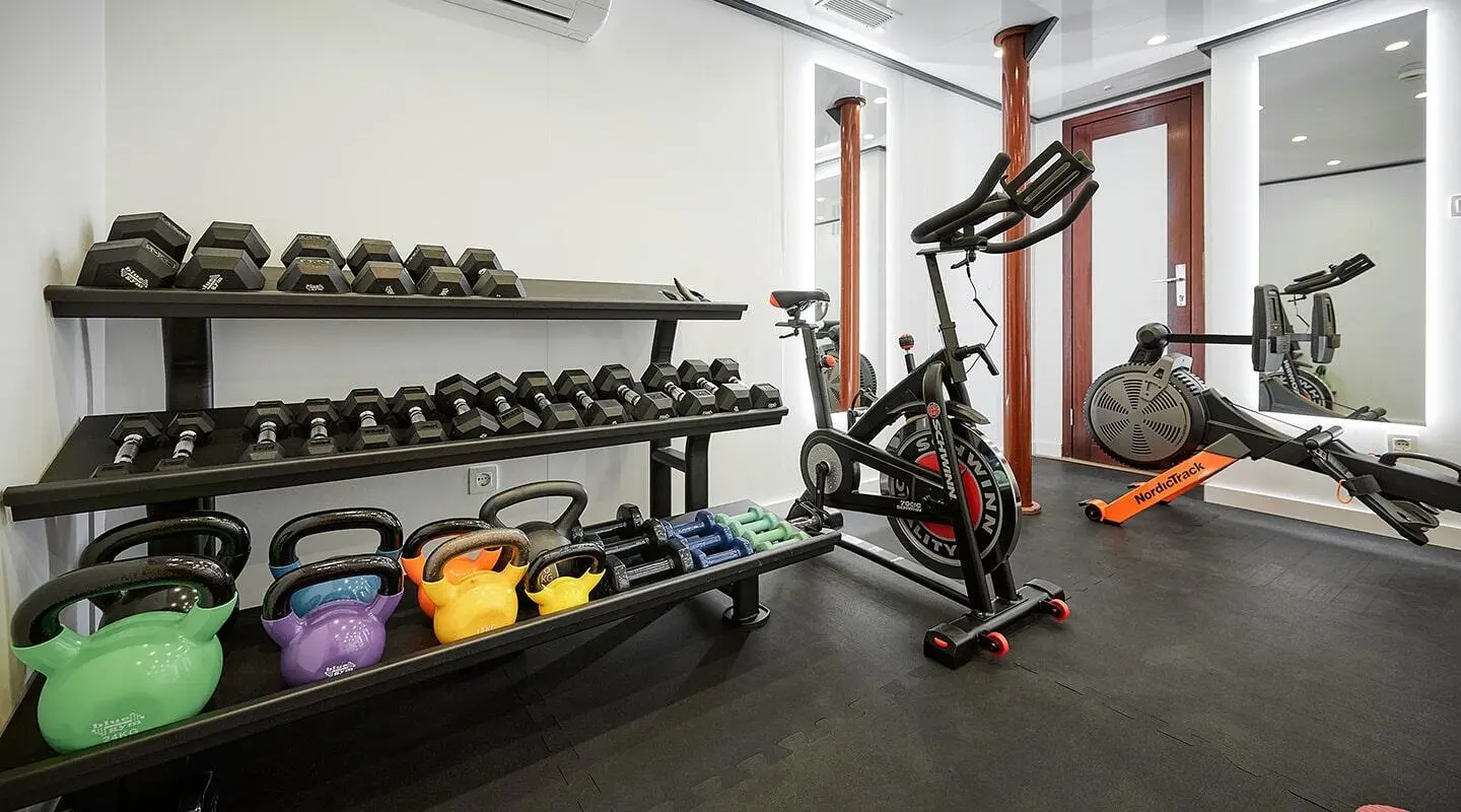 Lupus Mare yacht gym area with weights and exercise machine on deck