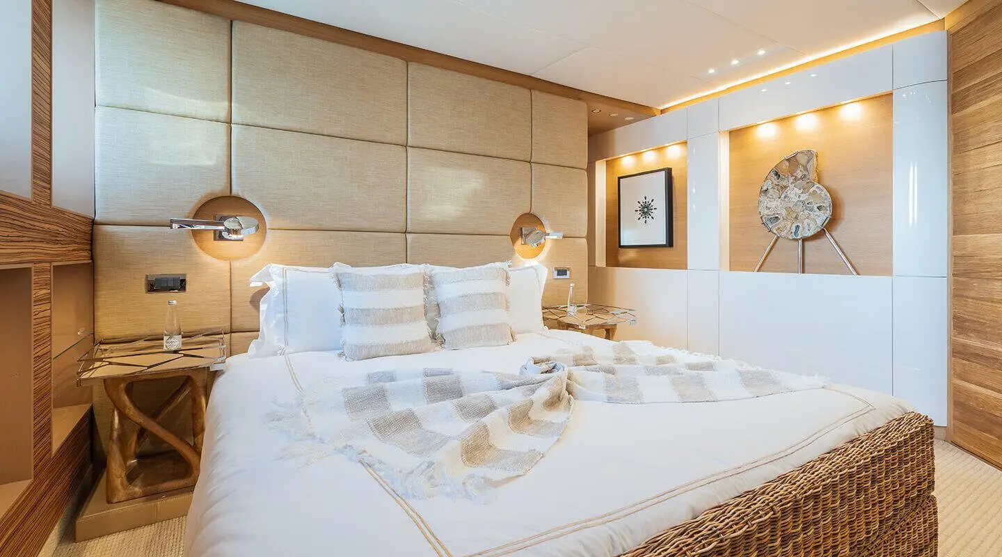 Bedroom with upholstered headboard and wood accents, luxurious bed setup