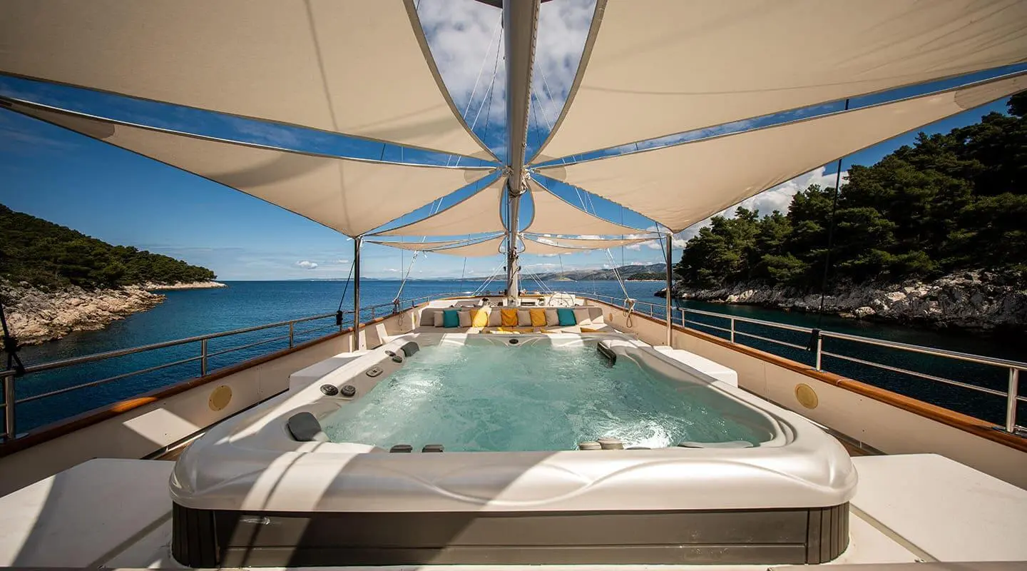 Sundeck of Dalmatino yacht with a Jacuzzi and sea view