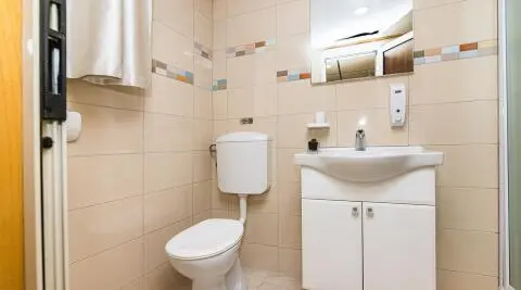 Modern bathroom with toilet and sink in a small space
