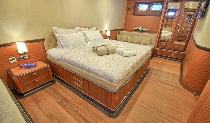 Queen Of Salmakis master cabin aboard gulet, queen bed, wooden flooring