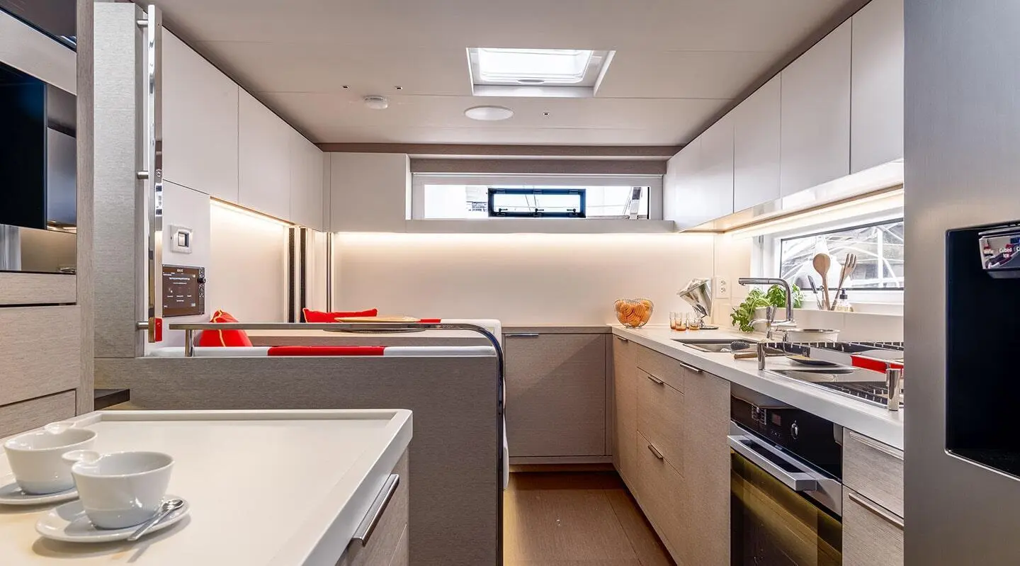 Interior deck of Daiquiri yacht: compact galley and seating area