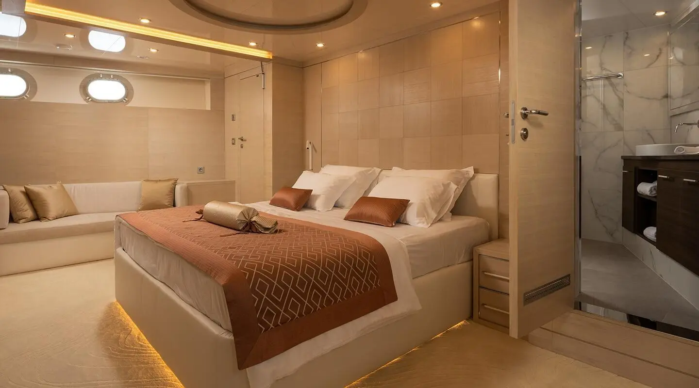 Love Story yacht interior with two large beds, warm lighting, neutral decor