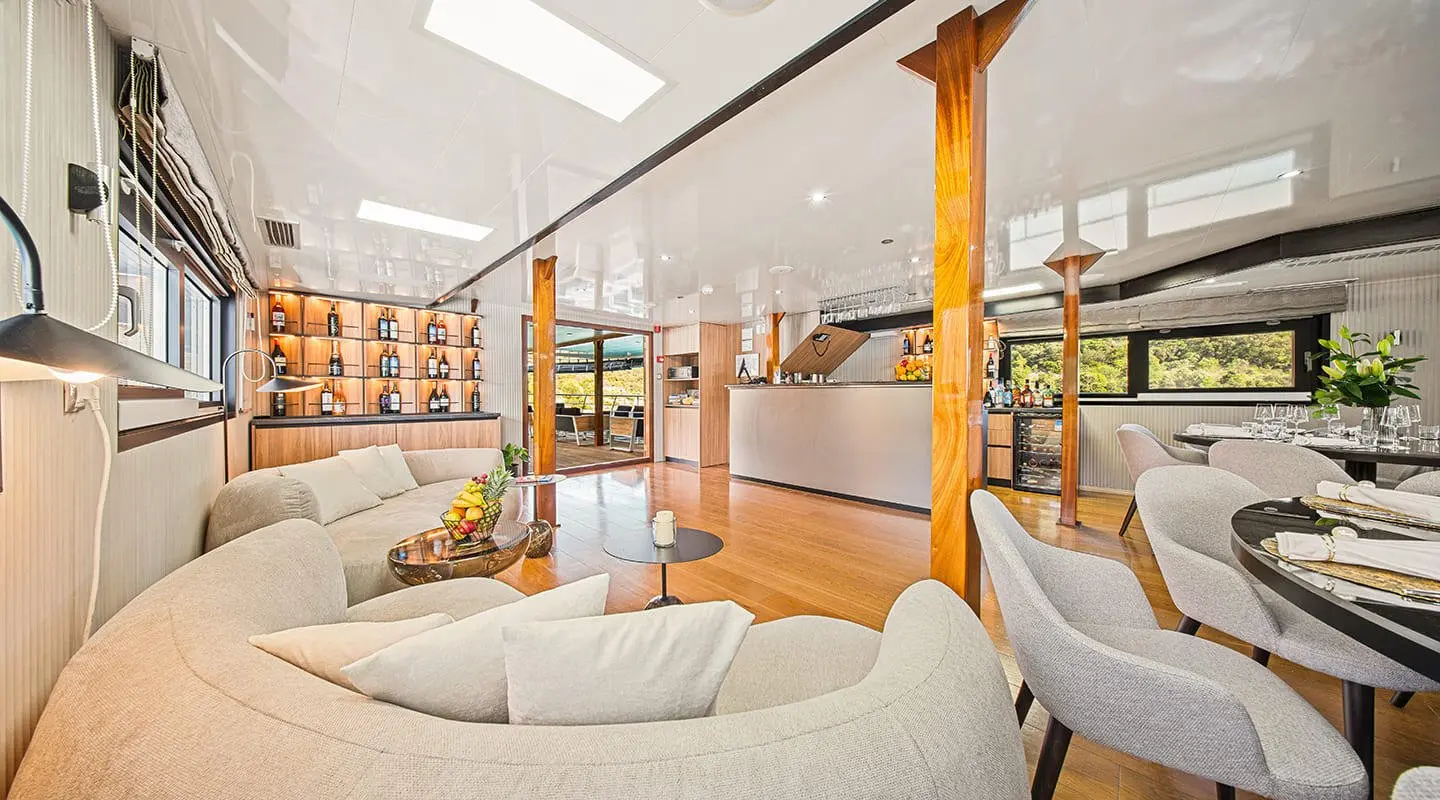 Karizma yacht saloon interior with white sofas and wooden accents