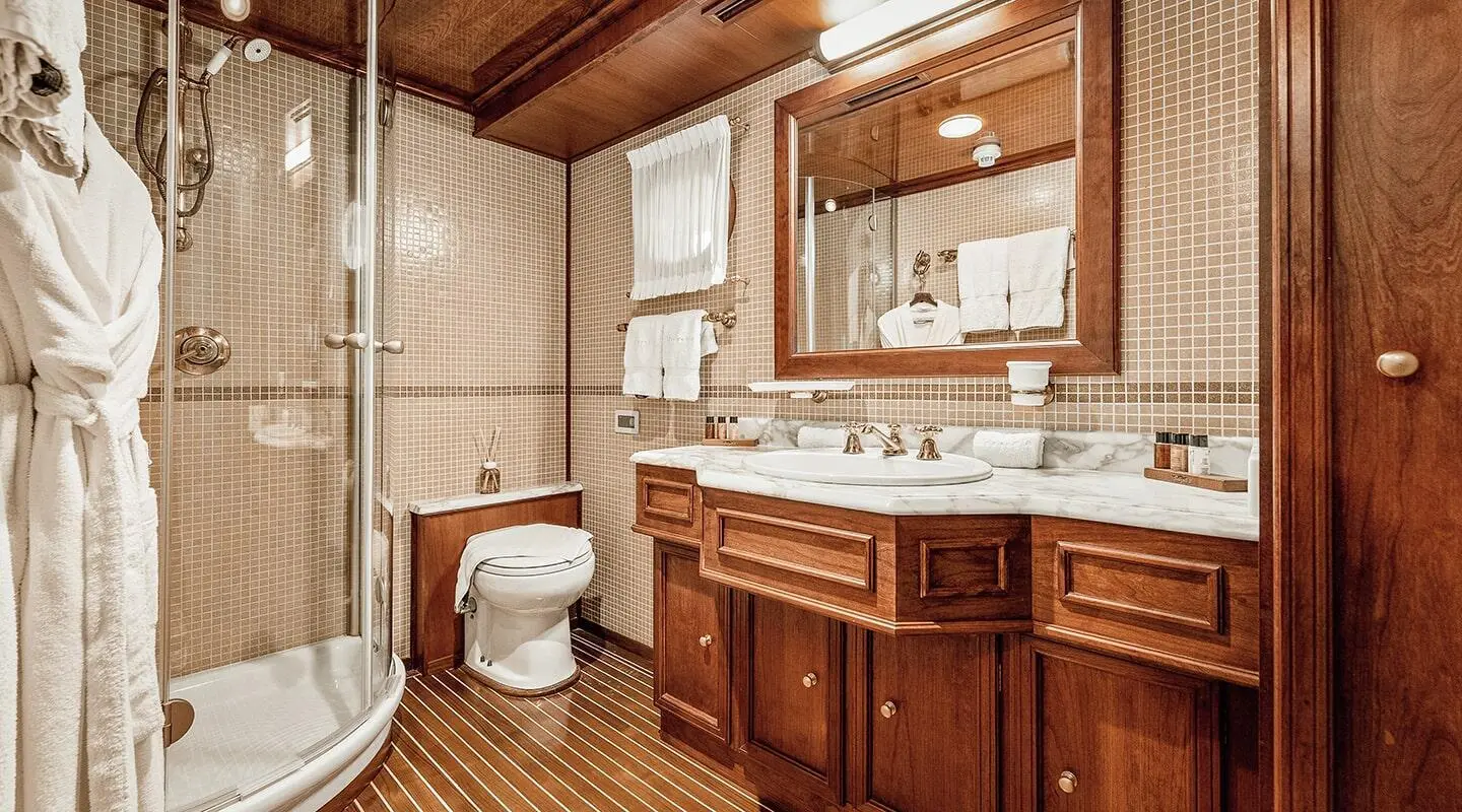 Seagull II yacht interior: wood cabinetry, sink, mirror, and countertop