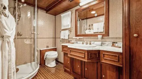Seagull II yacht interior: wood cabinetry, sink, mirror, and countertop
