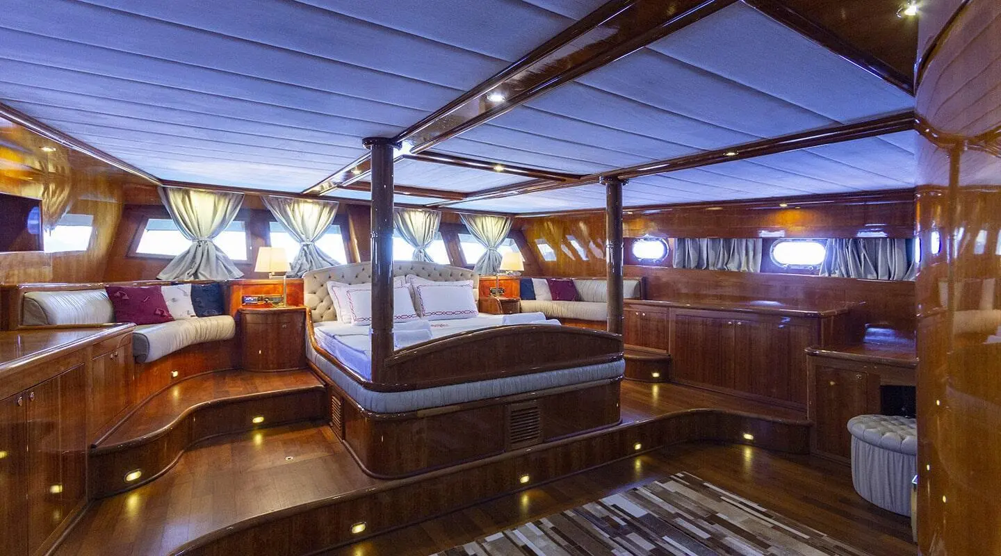 Silver Moon yacht interior at sunset with wooden seating and soft lighting