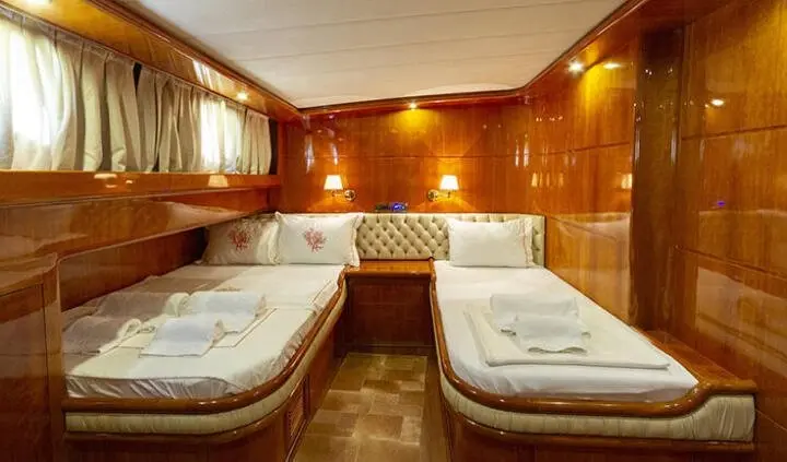 Twin-cabin Silver Moon yacht interior with two beds and wooden paneling